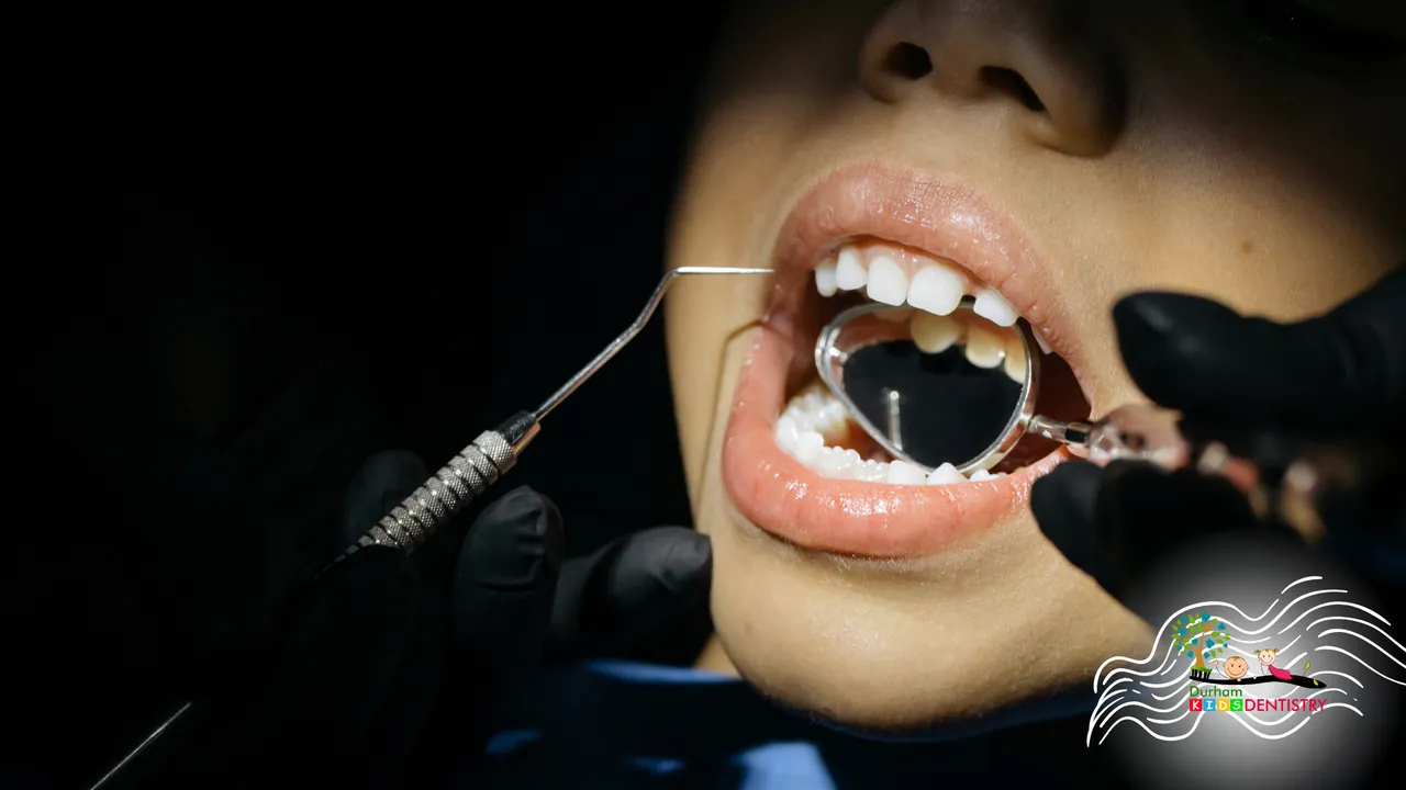 A woman is getting her teeth examined by a dentist.