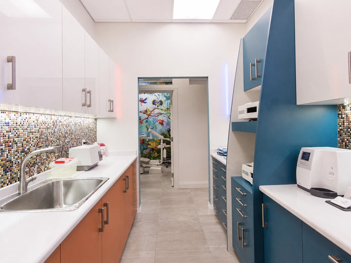 Hallway with sterilization station and view into a treatment room