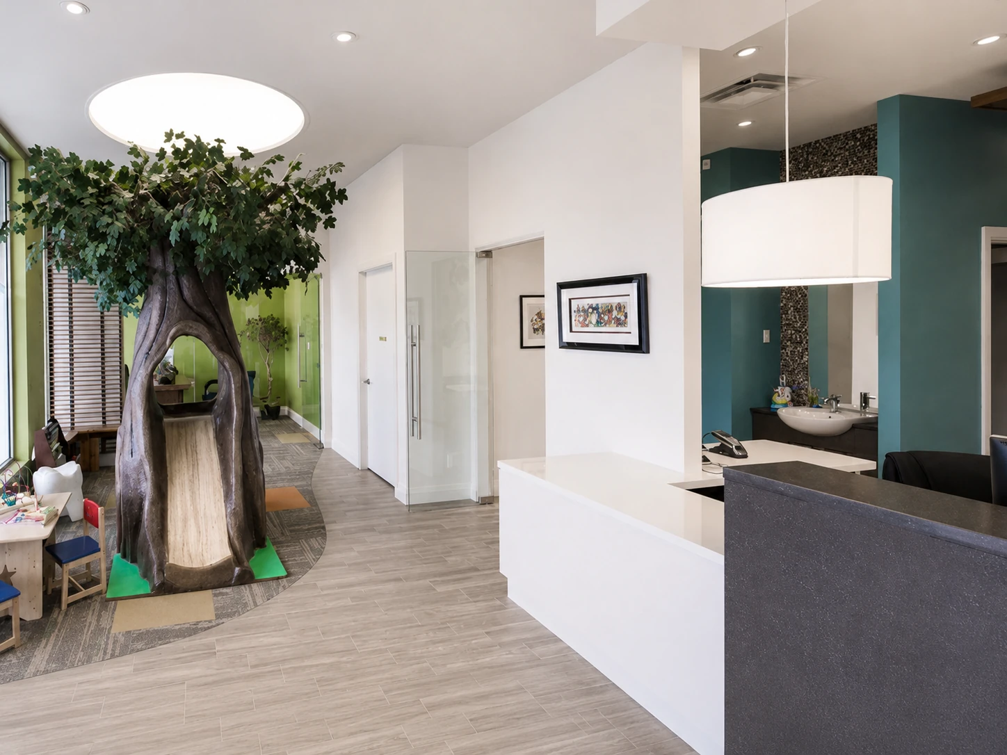 Reception desk with the tree-trunk reading nook visible